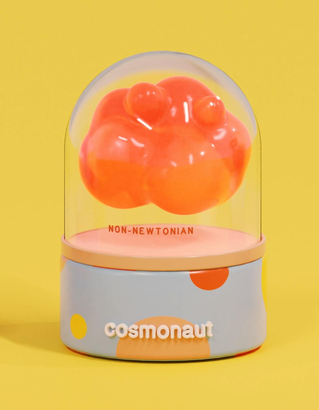 a floating bumpy form floats in its capsule, made up of spheres clumped together. the texture is akin to jelly. the label on the capsule reads, 'non-newtonian'.