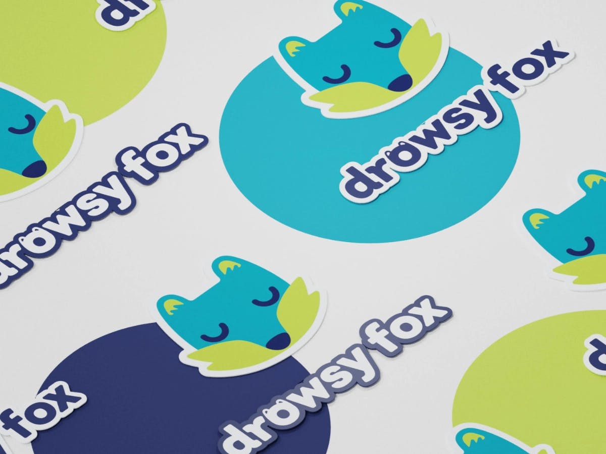 stickers featuring the drowsy fox logo and its logotype 