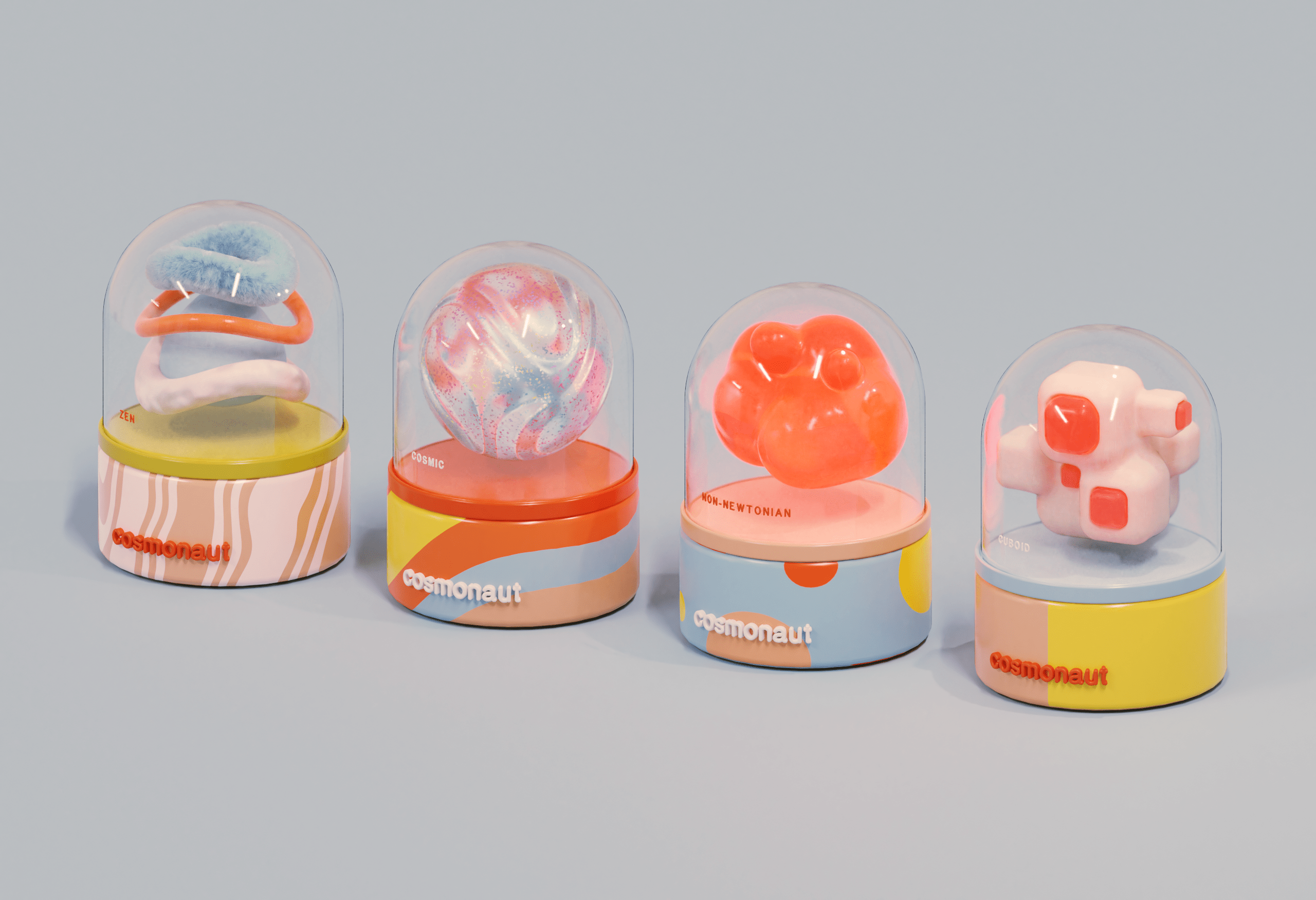 four capsule-shaped packages, each containing an abstractly-shaped item behind a plastic dome. the base of each capsule reads "cosmonaut".